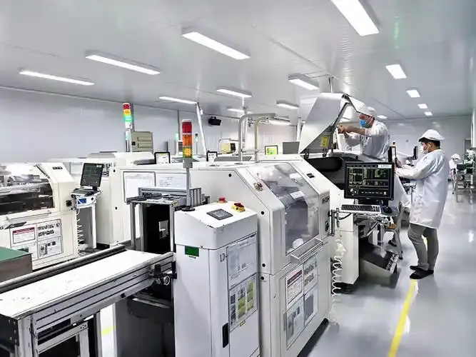 Skilled technician installing materials inside a large-scale manufacturing machine, highlighting Virtue's robust ODM structural design and production power.